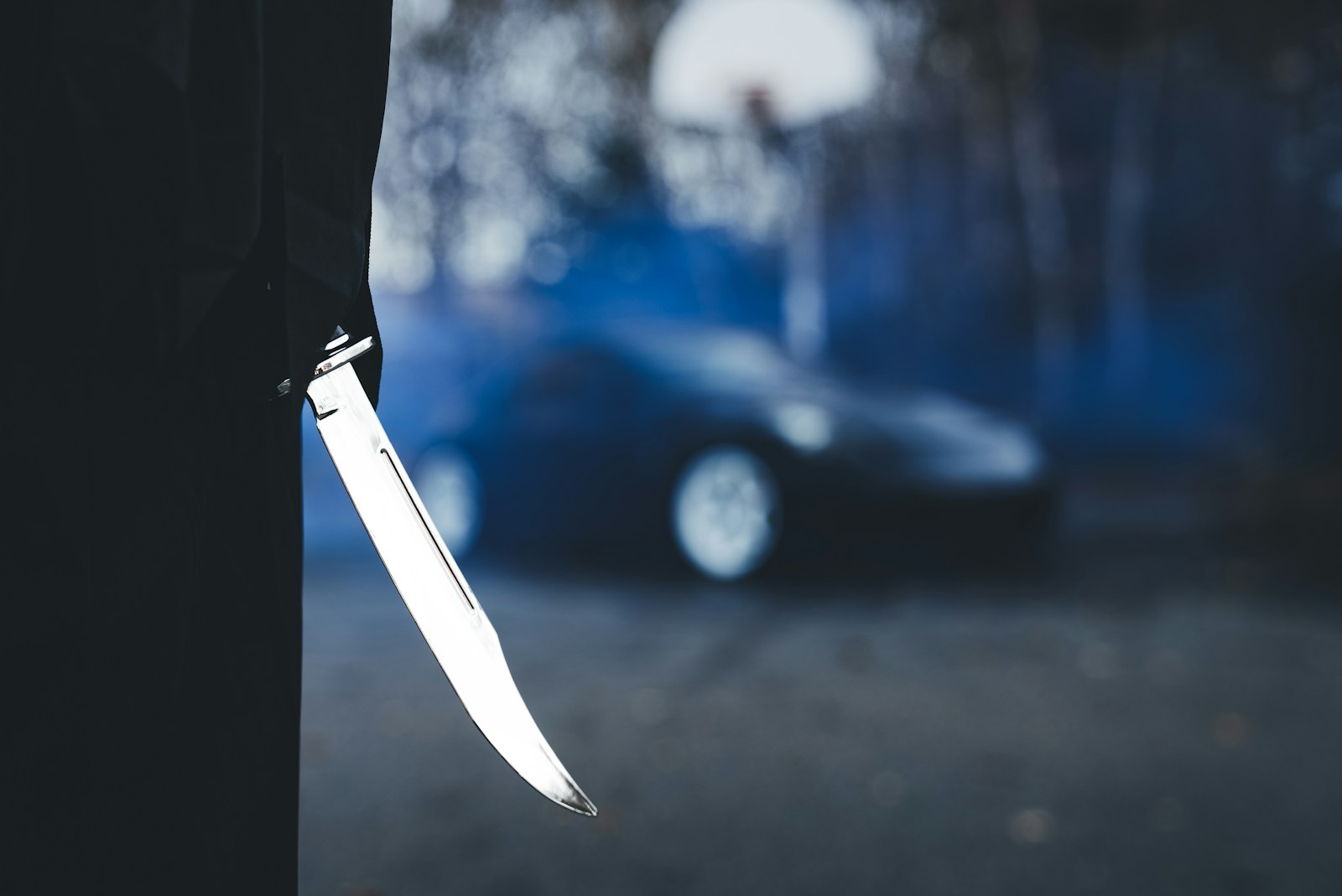 A knife sticking out of the side of a building