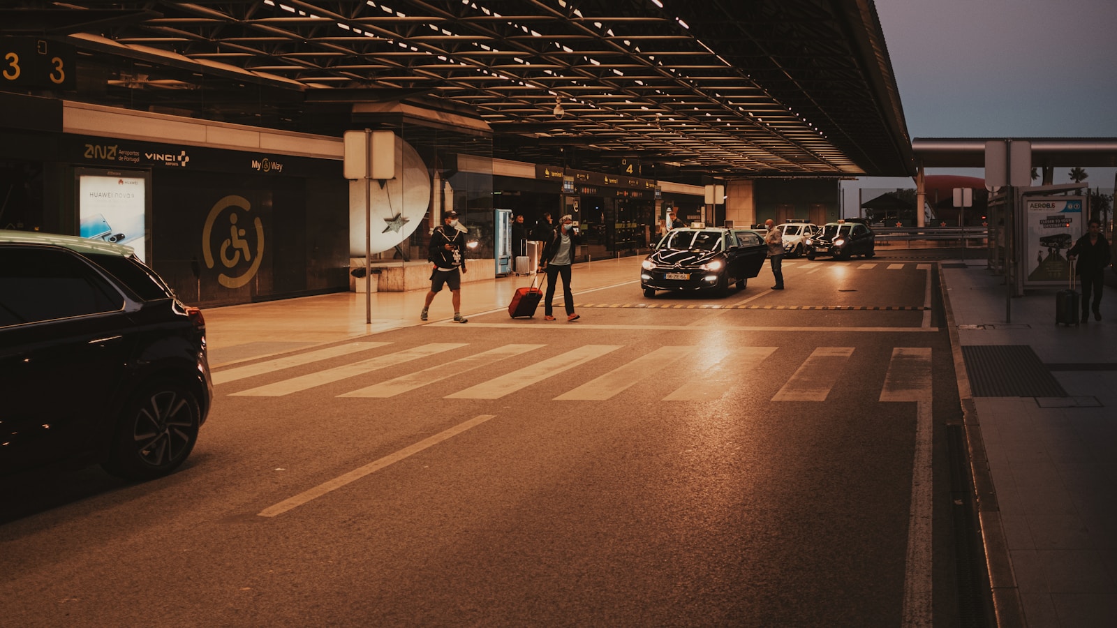 a couple of people walking across a street