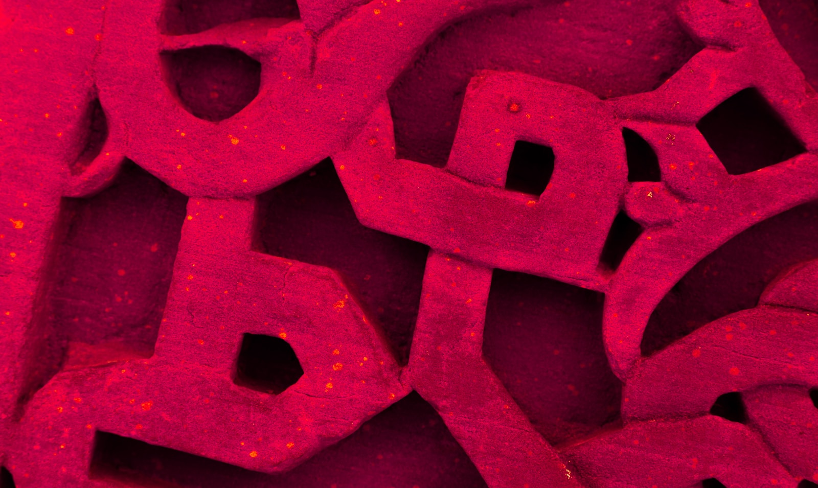 Abstract red pattern with small yellow dots
