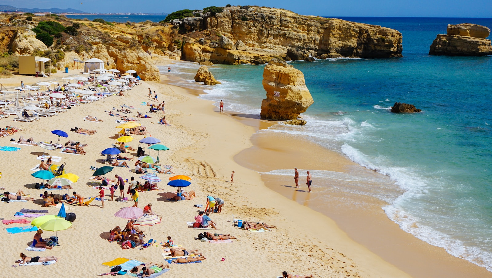 Praias Portugal people sun bathing on beach