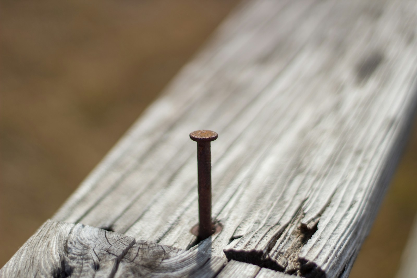 brown wooden stick on brown wooden surface